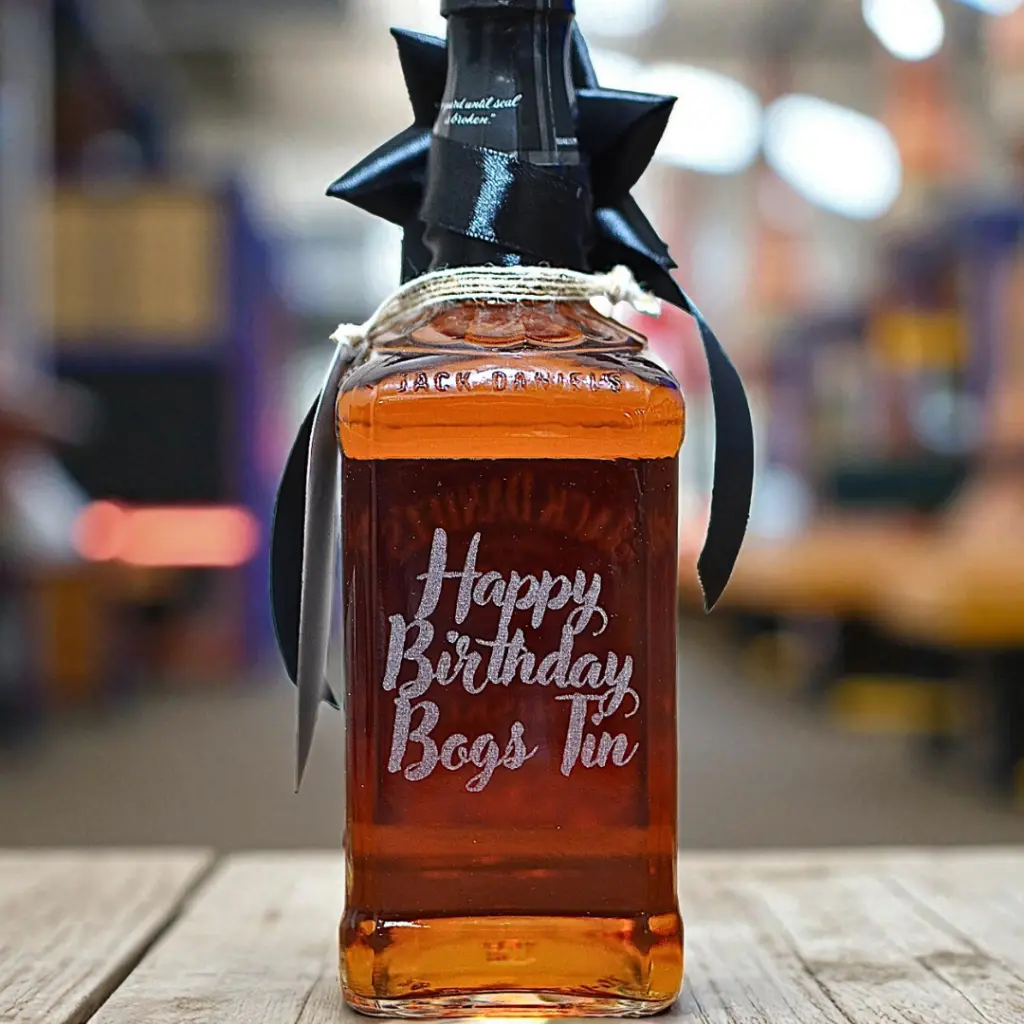 Text engraving on bottle .webp